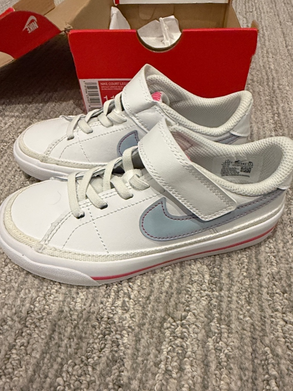 Nike Kids White Sneakers with Light Blue Swoosh and Pink Midsole Accent